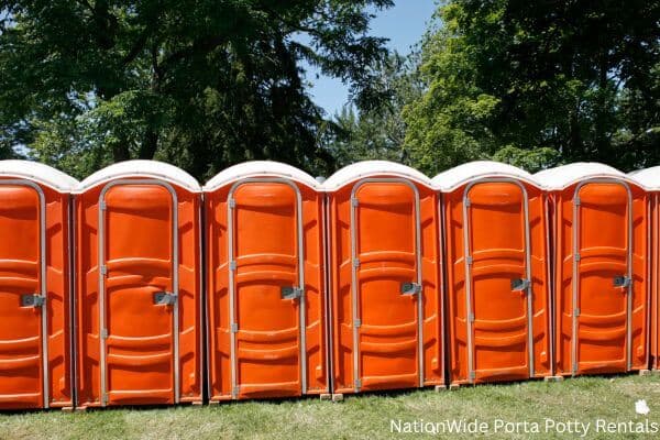 a lineup of clean and well-maintained portable loos for workers in Framingham, MA